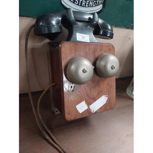 787 - 1940's Mahogany and Bakelite wall telephone. {28 cm H x 25 cm W x 13 cm D}.