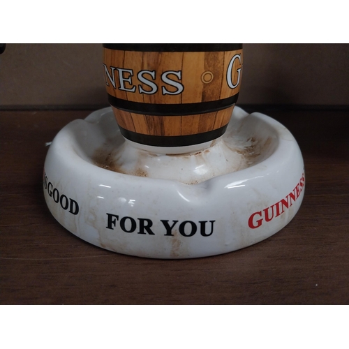 789 - Guinness ceramic match holder and strike. {10 cm H x 18 cm Dia.}