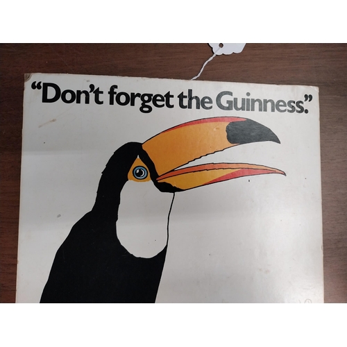 814 - Don't Forget the Guinness cardboard showcard. {29 cm H x 25 cm W}.