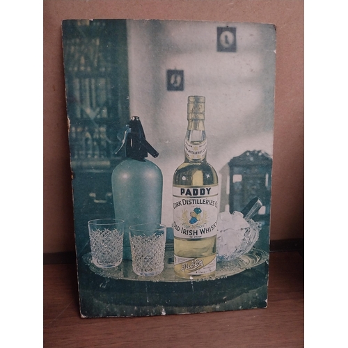 816 - Paddy Old Irish Whiskey {26 cm H x 18 cm W}  and John Powers Whiskey showcards {30 cm H x 18 cm W}.