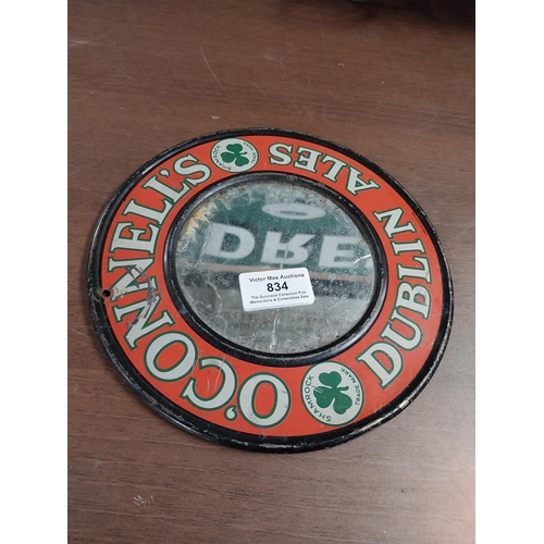 834 - O'Connell's Dublin Ales tinplate advertising mirror. {20 cm Dia.}.