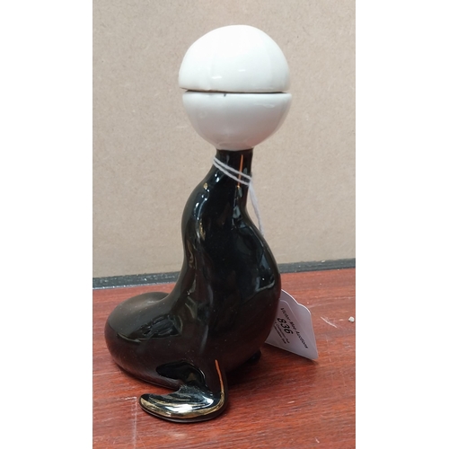 836 - Guinness ceramic seal in the form of a bottle {14 cm H x 9 cm W x 7 cm D} and Kangaroo {10 cm H x 9 ... 