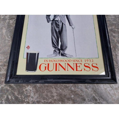 857 - In Hollywood since 1932 Charlie Chaplin Guinness framed advertising print. {60 cm H x 50 cm W}.