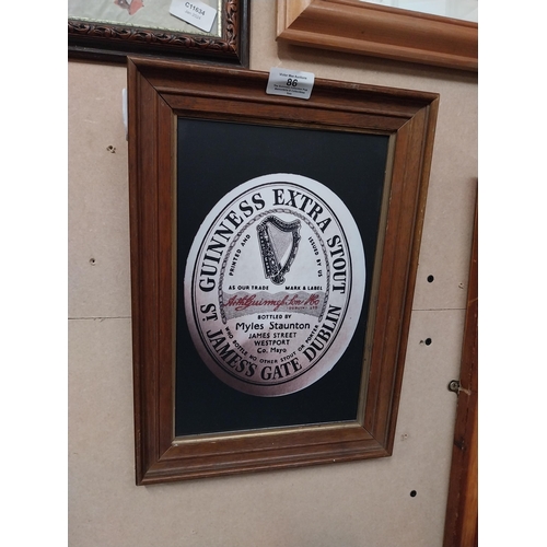 86 - Framed Guinness print. {37 cm H x 27 cm W}.