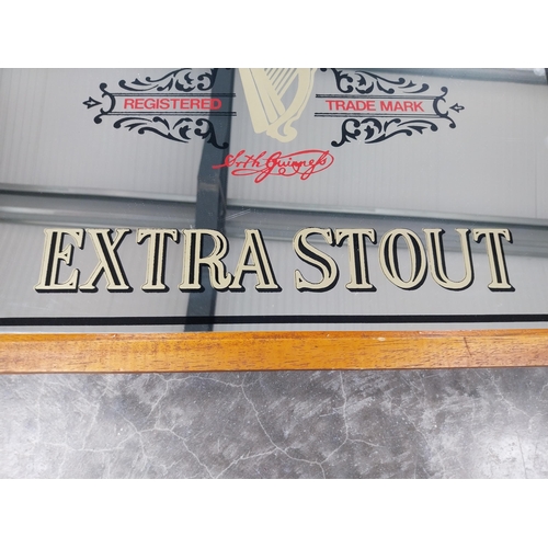 861 - Guinness Extra Stout framed advertising mirror. {48 cm H x 58 cm W].