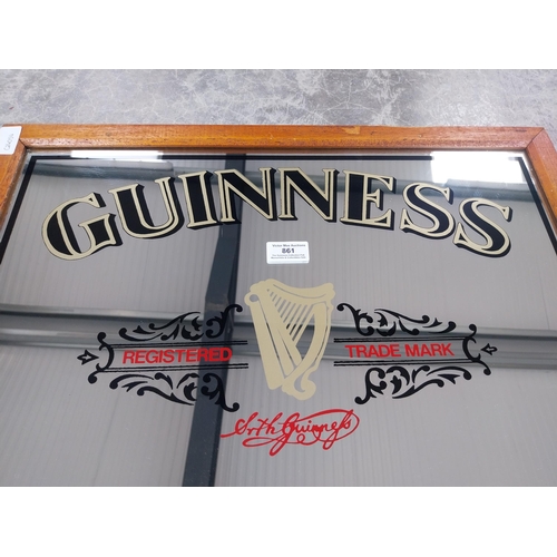 861 - Guinness Extra Stout framed advertising mirror. {48 cm H x 58 cm W].