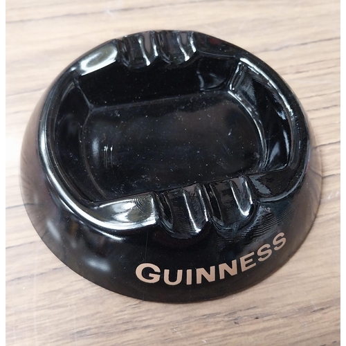 867 - Two glass Guinness ashtrays {4 cm H x 17 cm Dia.} approx.