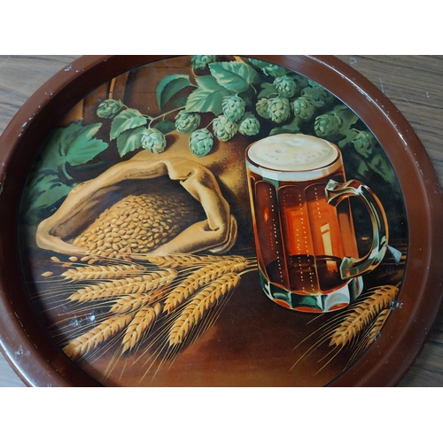 886 - Guinness for Strength tinplate drinks tray {34 cm Dia.} and another pictorial drinks tray. {27 cm Di... 