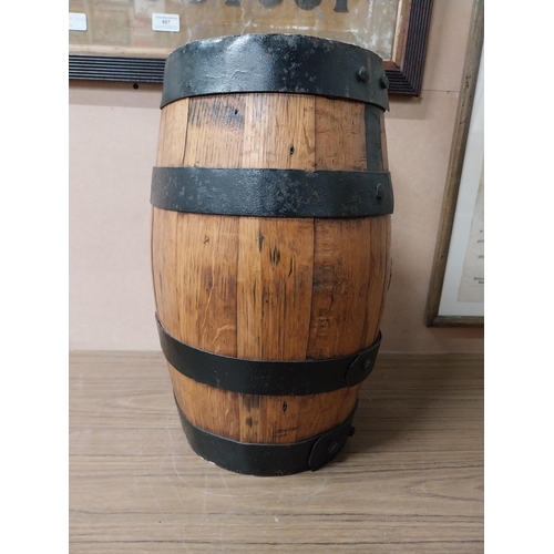 910 - Oak metal bound barrel with tap {43 cm H x 25 cm W}