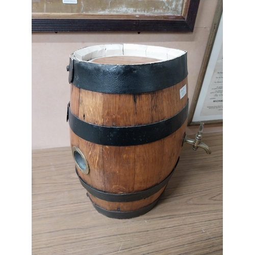 910 - Oak metal bound barrel with tap {43 cm H x 25 cm W}