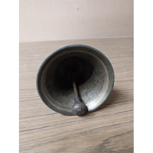 913 - Victorian brass pub bell with wooden handle. {23 cm H x 12 cm Dia.}.