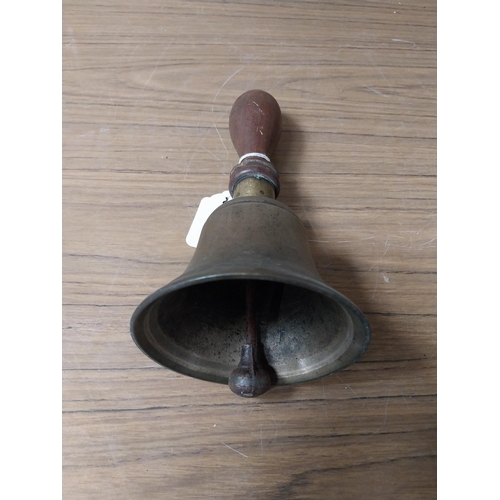 913 - Victorian brass pub bell with wooden handle. {23 cm H x 12 cm Dia.}.