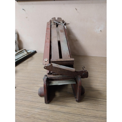 914 - Early 20th C. metal paper cutter. {30 cm H x 60 cm W x 17 cm D}