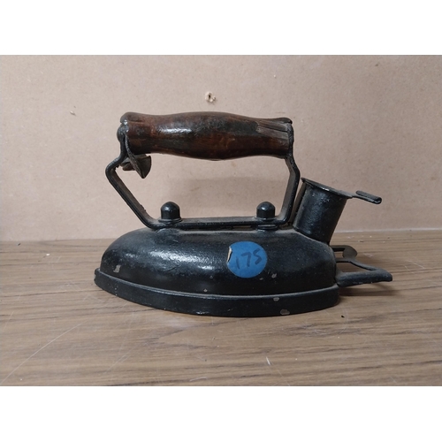 936 - Shoe last {20 cm H 17 cm H}  and two metal irons {15 cm H}.