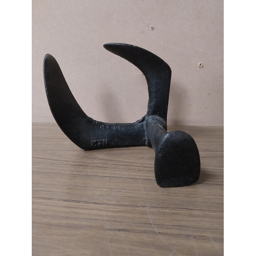 936 - Shoe last {20 cm H 17 cm H}  and two metal irons {15 cm H}.