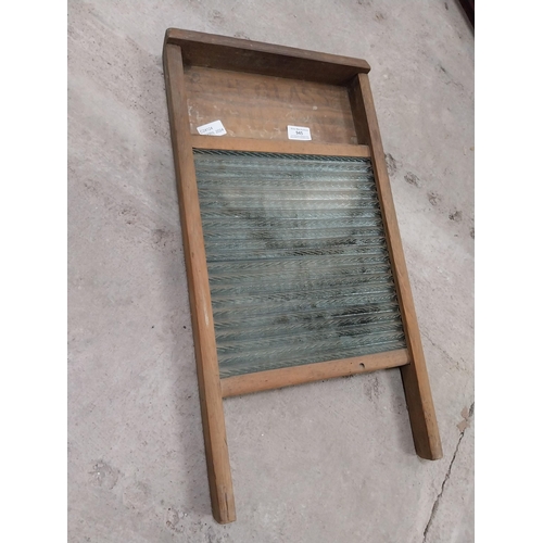 945 - Pine and glass washboard. {61 cm H x 31 cm W}.