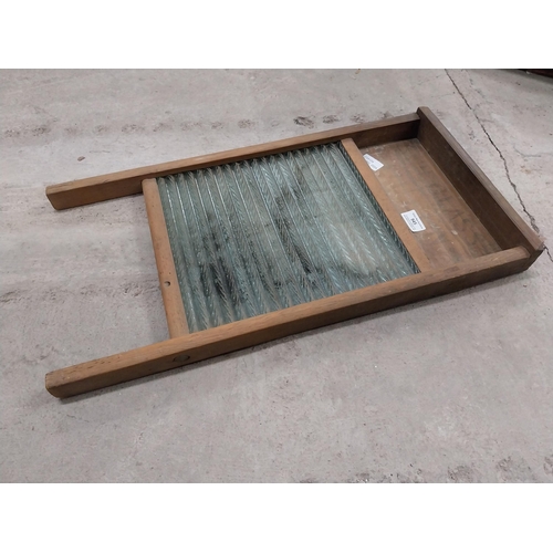 945 - Pine and glass washboard. {61 cm H x 31 cm W}.