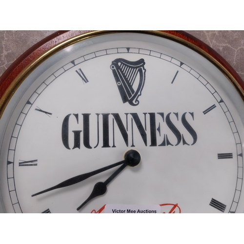 966 - Guinness advertising clock. {27 cm Dia}. PART OF THE DAVID HUGHES COLLECTION.