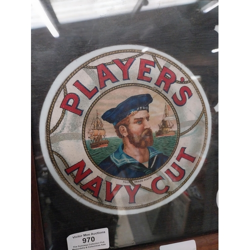 970 - Player's Navy Cut Cigarettes framed advertising showcard. {27 cm H x 62 cm W}.