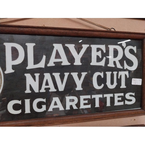 970 - Player's Navy Cut Cigarettes framed advertising showcard. {27 cm H x 62 cm W}.