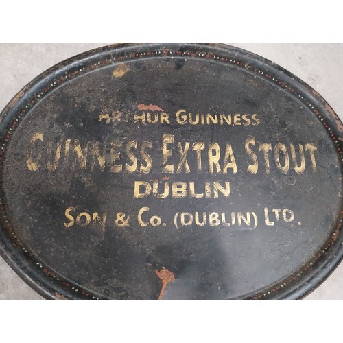 331 - Two early 20th C. tinplate drinks trays - Guinness and Co's on Draught Dublin and Arthur Guinness So... 