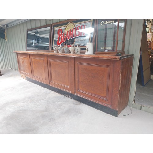 450A - Early 20th C. mahogany and pine bar counter with four inset panels {104 cm H x 410 cm W x 65 cm D}.