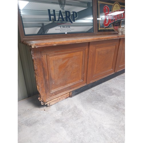 450A - Early 20th C. mahogany and pine bar counter with four inset panels {104 cm H x 410 cm W x 65 cm D}.