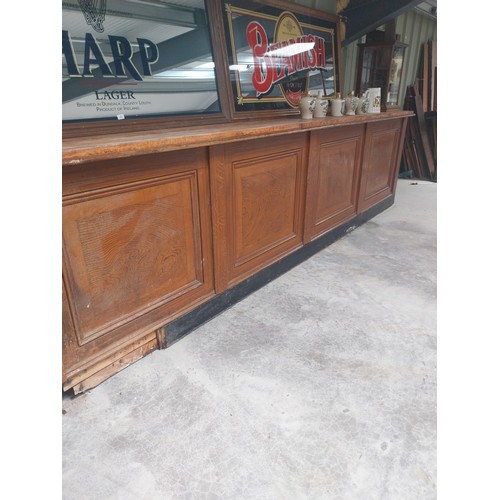 450A - Early 20th C. mahogany and pine bar counter with four inset panels {104 cm H x 410 cm W x 65 cm D}.