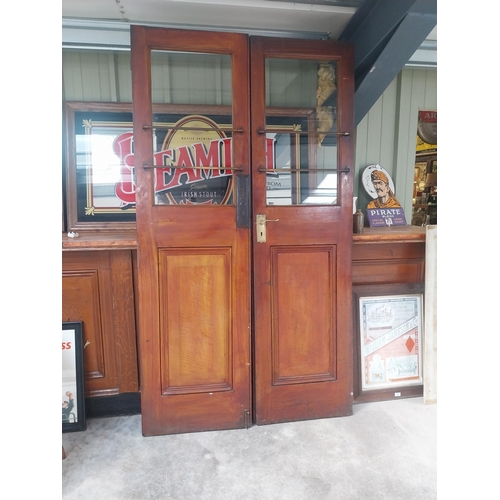 450C - Pair of mahogany doors with brass handles {209 cm H x 57 cm W each}.