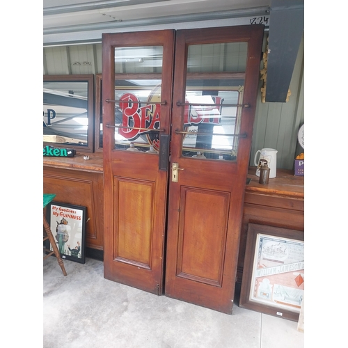 450C - Pair of mahogany doors with brass handles {209 cm H x 57 cm W each}.