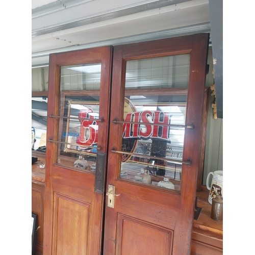 450C - Pair of mahogany doors with brass handles {209 cm H x 57 cm W each}.