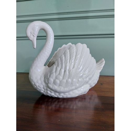 105 - Ceramic vase in the form of a Swan {29 cm H x 24 cm W x 21 cm D}.