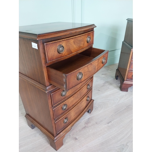 106 - Pair of good quality mahogany bedside lockers with five graduated drawers raised on bracket feet in ... 