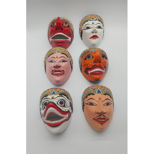 108 - Collection of six hand painted coconut tree wood tribal masks {Approx. 20 cm H x 16 cm W x 14 cm D}.