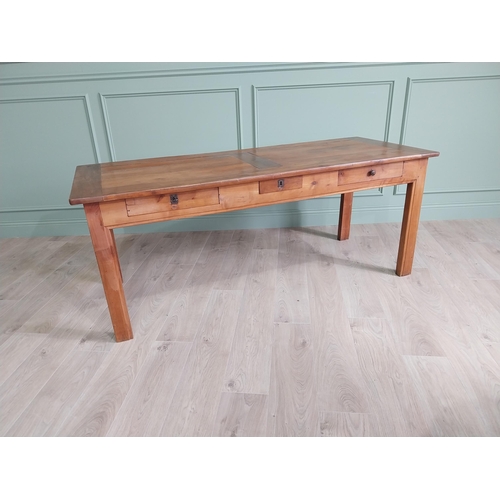 114 - Good quality early 20th C. cherrywood kitchen table with three drawers in the frieze raised on squar... 