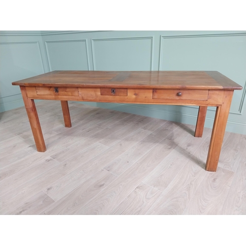 114 - Good quality early 20th C. cherrywood kitchen table with three drawers in the frieze raised on squar... 