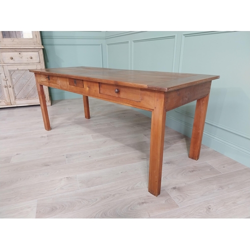 114 - Good quality early 20th C. cherrywood kitchen table with three drawers in the frieze raised on squar... 