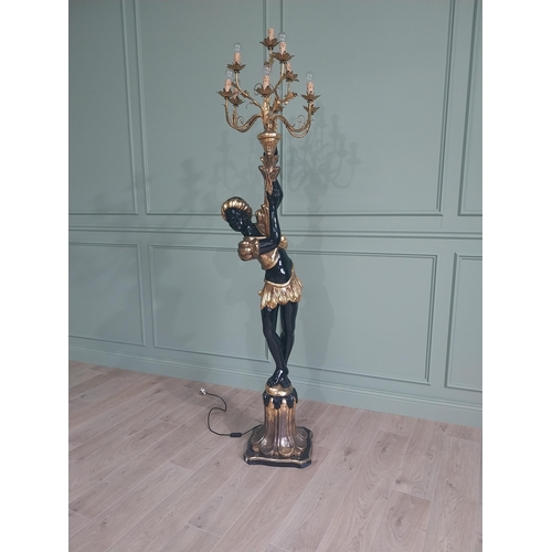 120 - Decorative gilded and ebonised wooden torchiere in the form of a boy {200 cm H x 40 cm W x 40 cm D}.... 