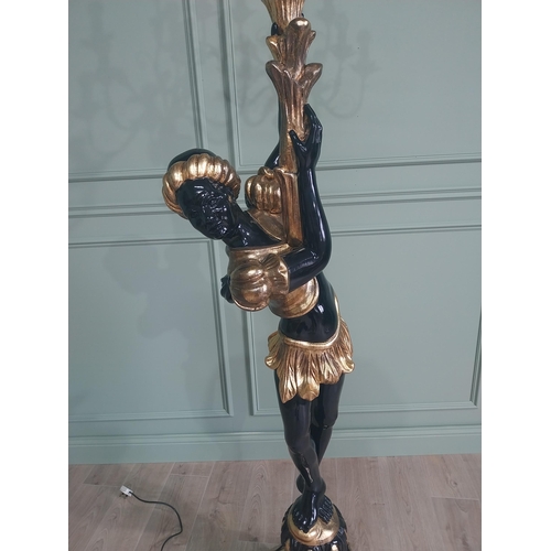 120 - Decorative gilded and ebonised wooden torchiere in the form of a boy {200 cm H x 40 cm W x 40 cm D}.... 