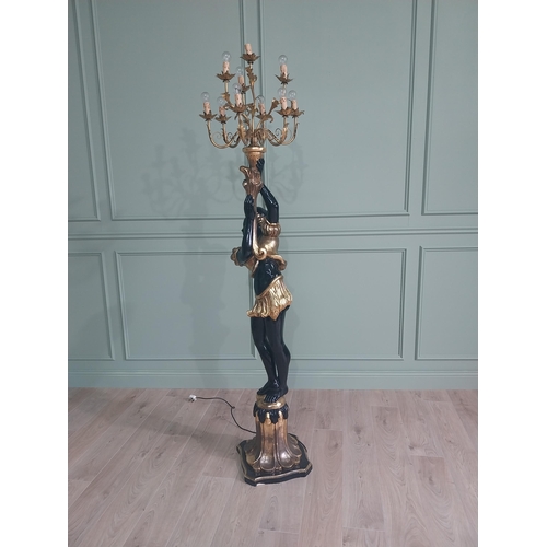 120 - Decorative gilded and ebonised wooden torchiere in the form of a boy {200 cm H x 40 cm W x 40 cm D}.... 