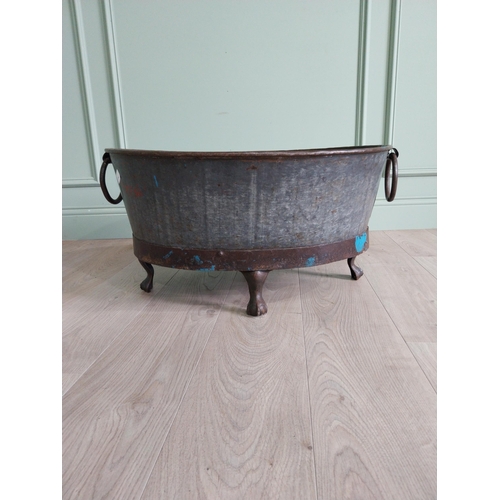 125 - Galvanised and metal log bucket with wrought iron handles raised on ball and claw feet {37 cm H x 74... 