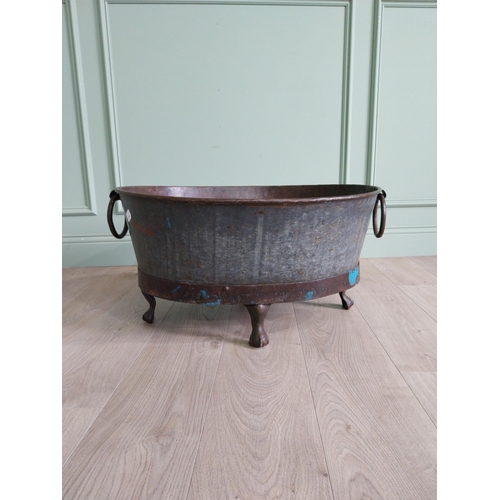 125 - Galvanised and metal log bucket with wrought iron handles raised on ball and claw feet {37 cm H x 74... 