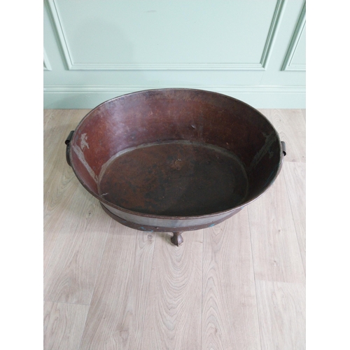 125 - Galvanised and metal log bucket with wrought iron handles raised on ball and claw feet {37 cm H x 74... 