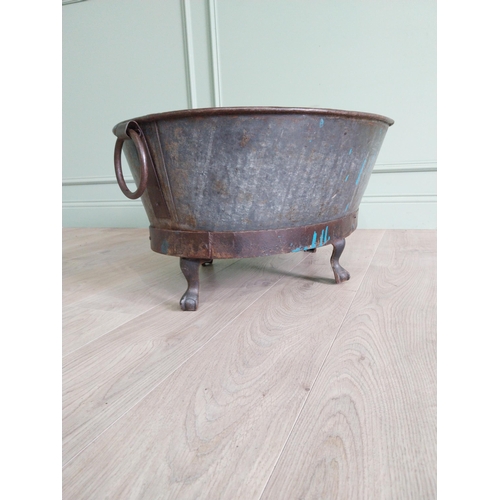 125 - Galvanised and metal log bucket with wrought iron handles raised on ball and claw feet {37 cm H x 74... 