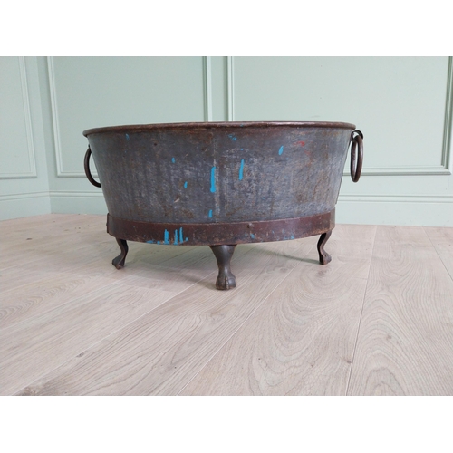 125 - Galvanised and metal log bucket with wrought iron handles raised on ball and claw feet {37 cm H x 74... 