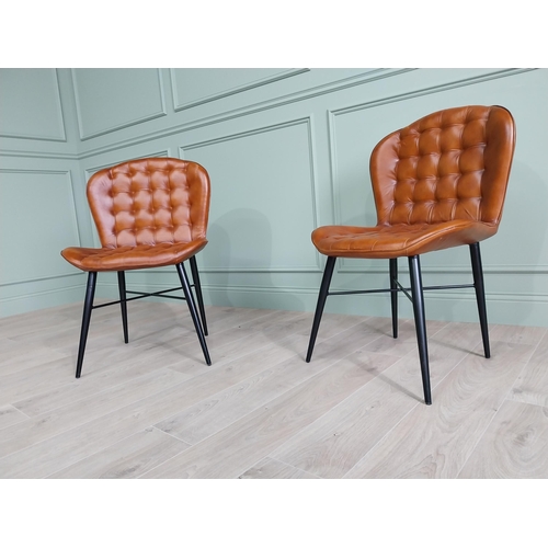 128 - Pair of hand dyed leather deep buttoned side chairs raised on metal tapered legs {90 cm H x 59 cm W ... 