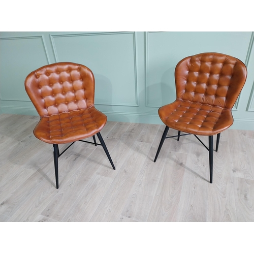 128 - Pair of hand dyed leather deep buttoned side chairs raised on metal tapered legs {90 cm H x 59 cm W ... 