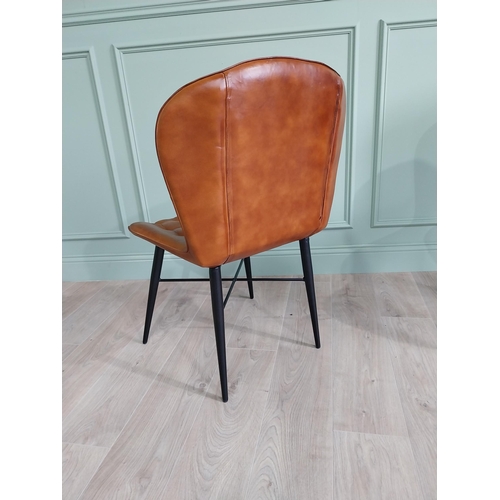 128 - Pair of hand dyed leather deep buttoned side chairs raised on metal tapered legs {90 cm H x 59 cm W ... 