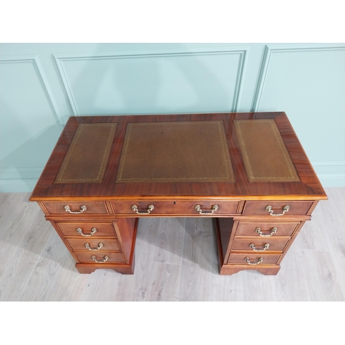 13 - Good quality mahogany pedestal desk with inset leather top raised on bracket feet in the Victorian s... 