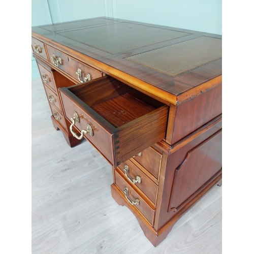 13 - Good quality mahogany pedestal desk with inset leather top raised on bracket feet in the Victorian s... 